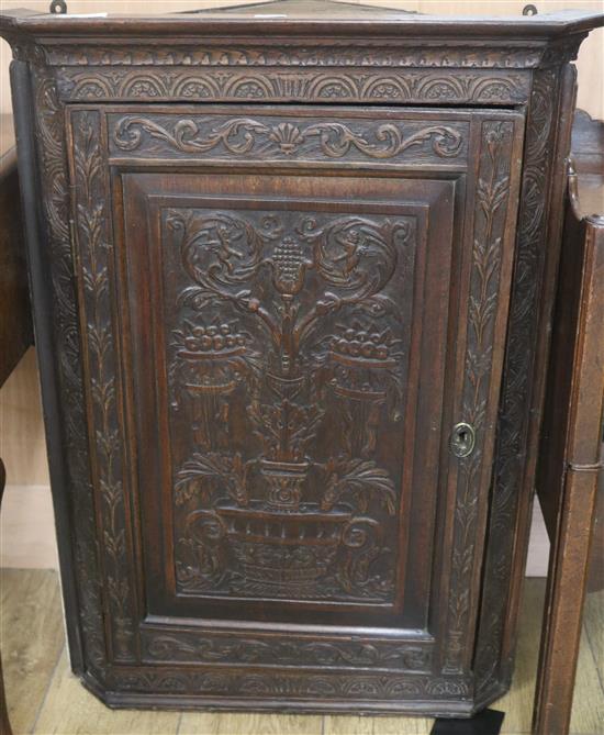 A late Victorian carved mahogany hanging cupboard, H.92cm